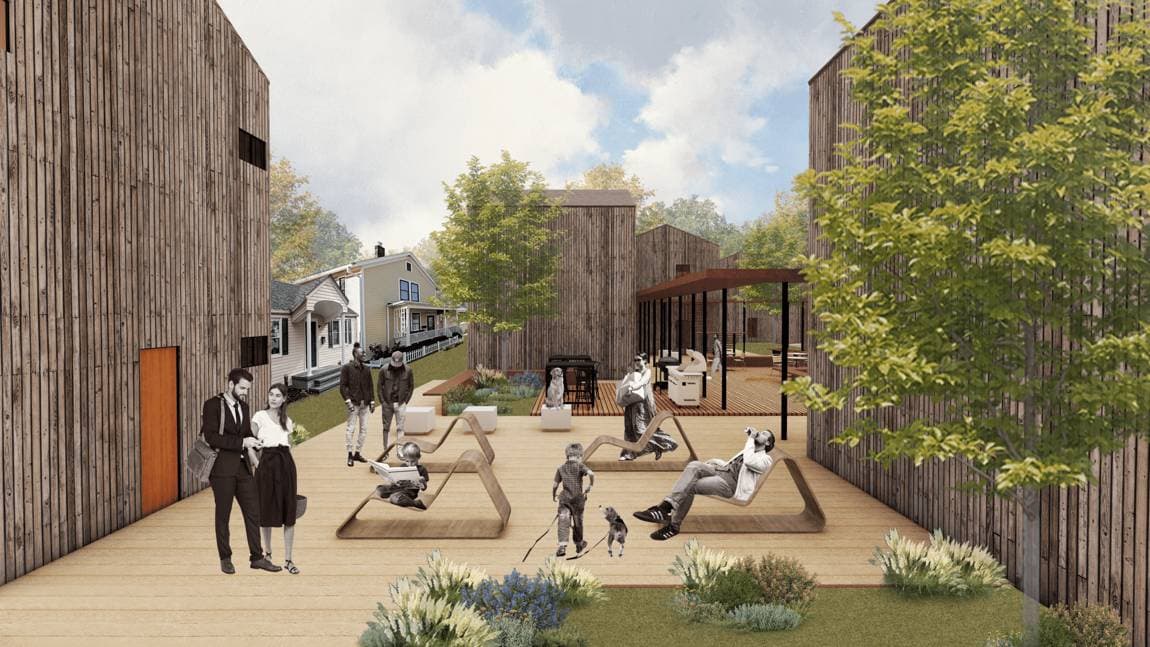 A timber courtyard connecting a group of contemporary buildings