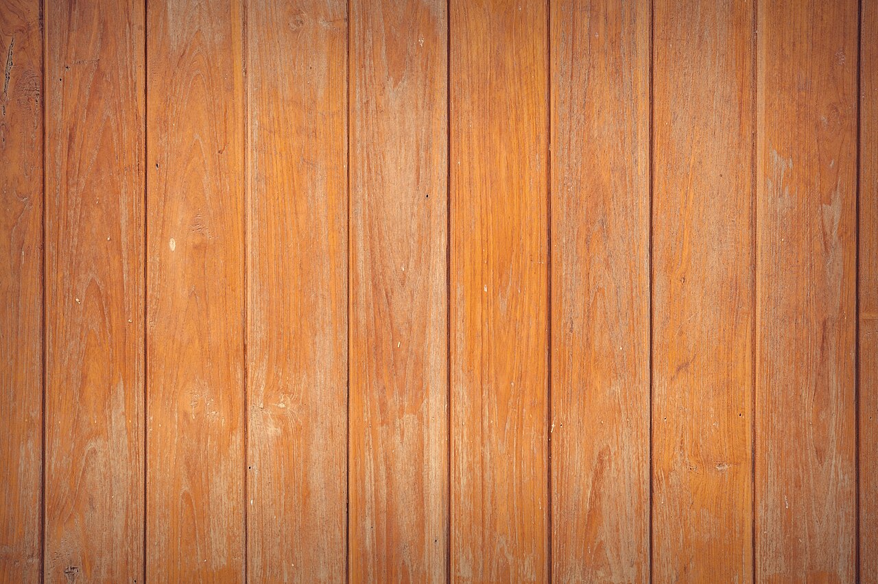 Scuffed wooden parquet flooring