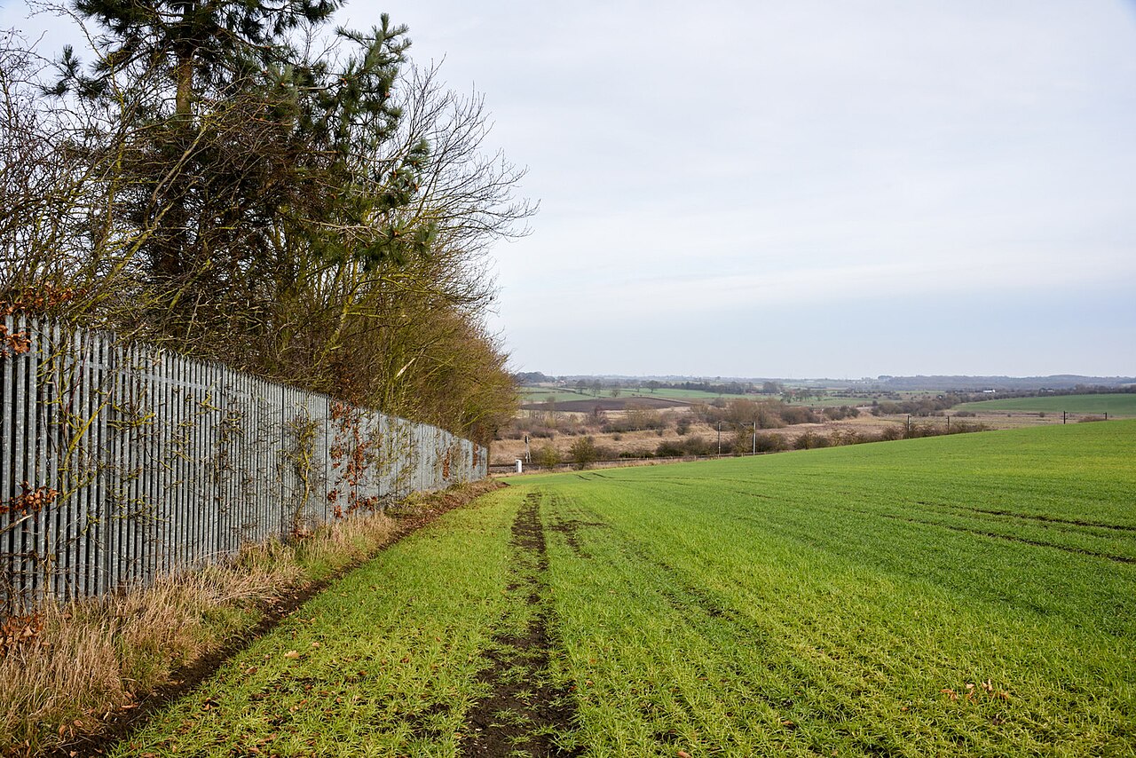 Steel palisade fence along the boundary of a sewage works