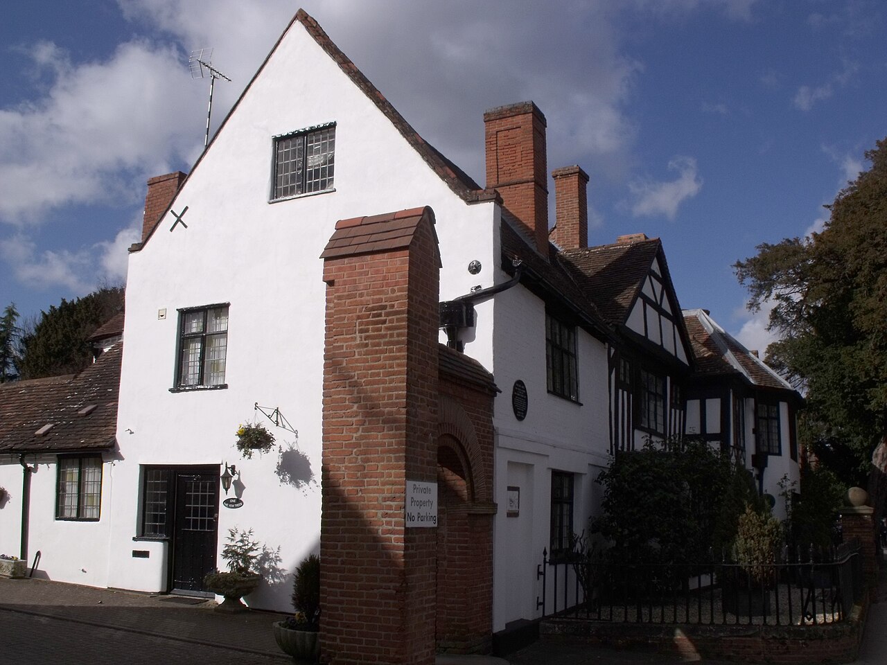 Yew Tree House in Henley-in-Arden, a listed timber-framed building with a painted brick addition and a rendered brick part