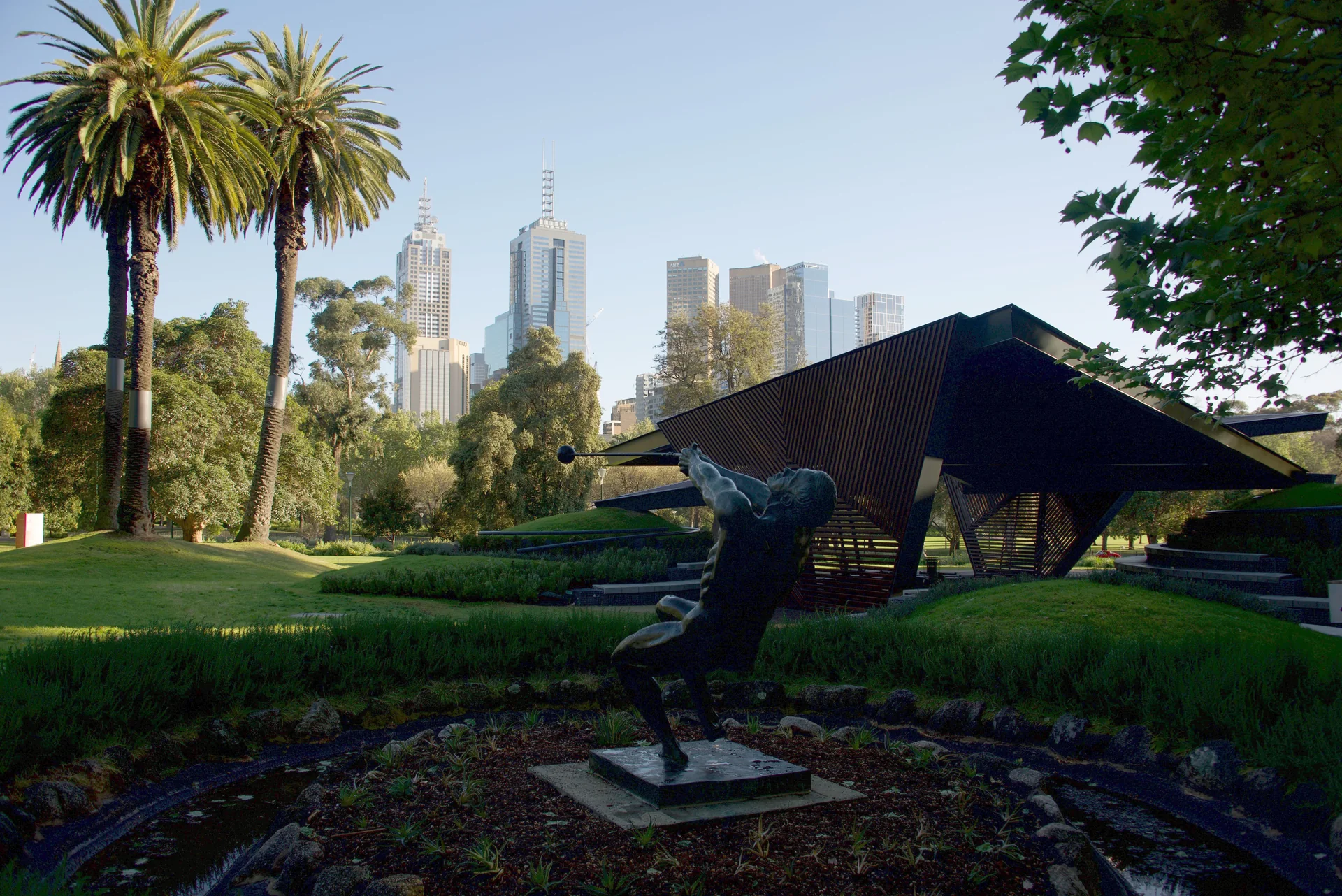 MPavilion 2018 in Melbourne, a timber lattice roof with a transparent polycarbonate layer