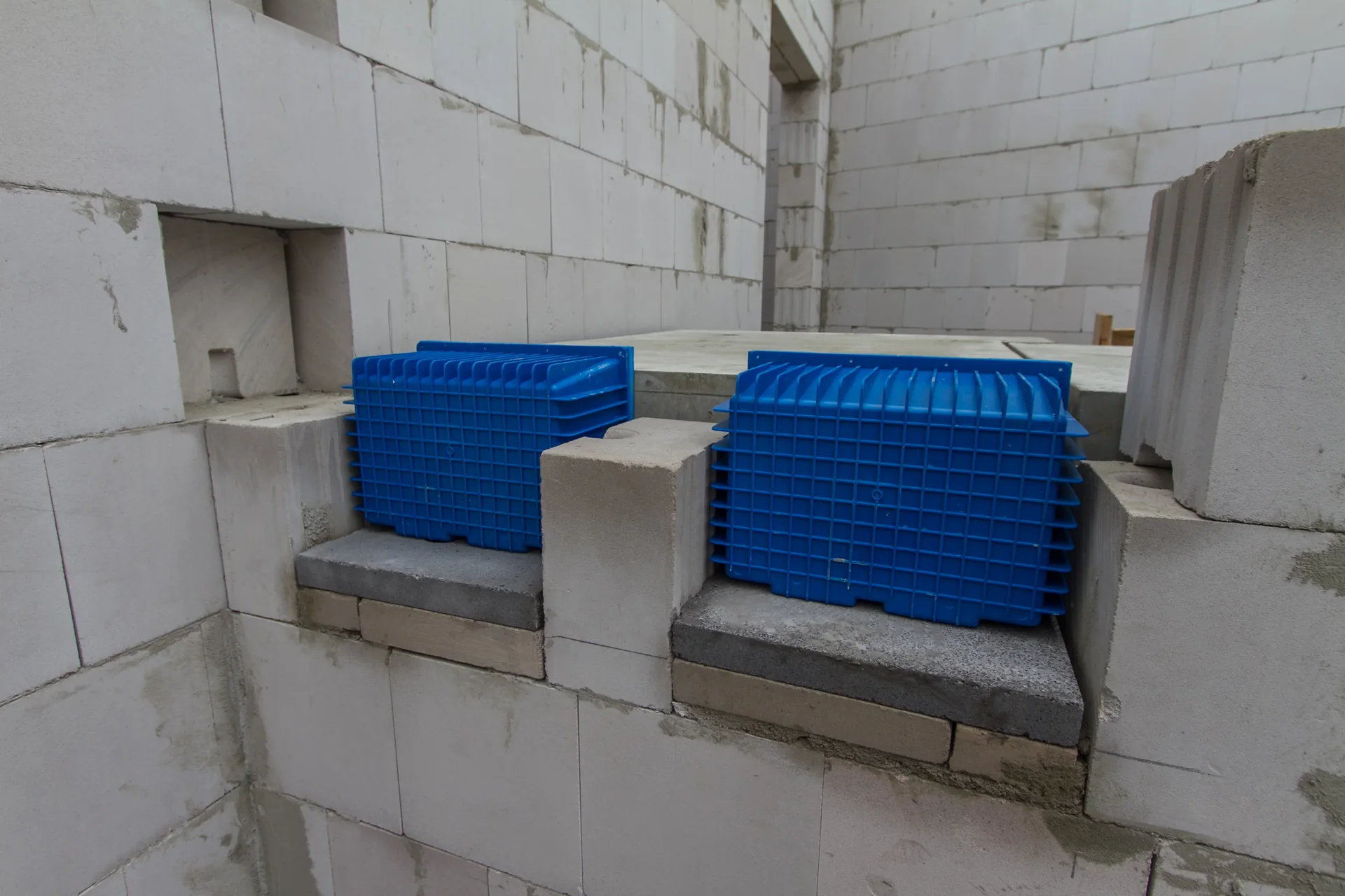 Isolating bearings being installed for a precast concrete stair landing