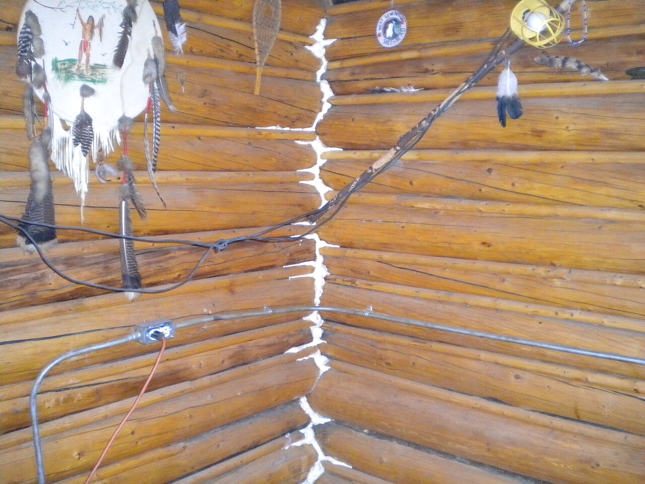 Spray foam insulation applied in the corners of a timber house in Alaska