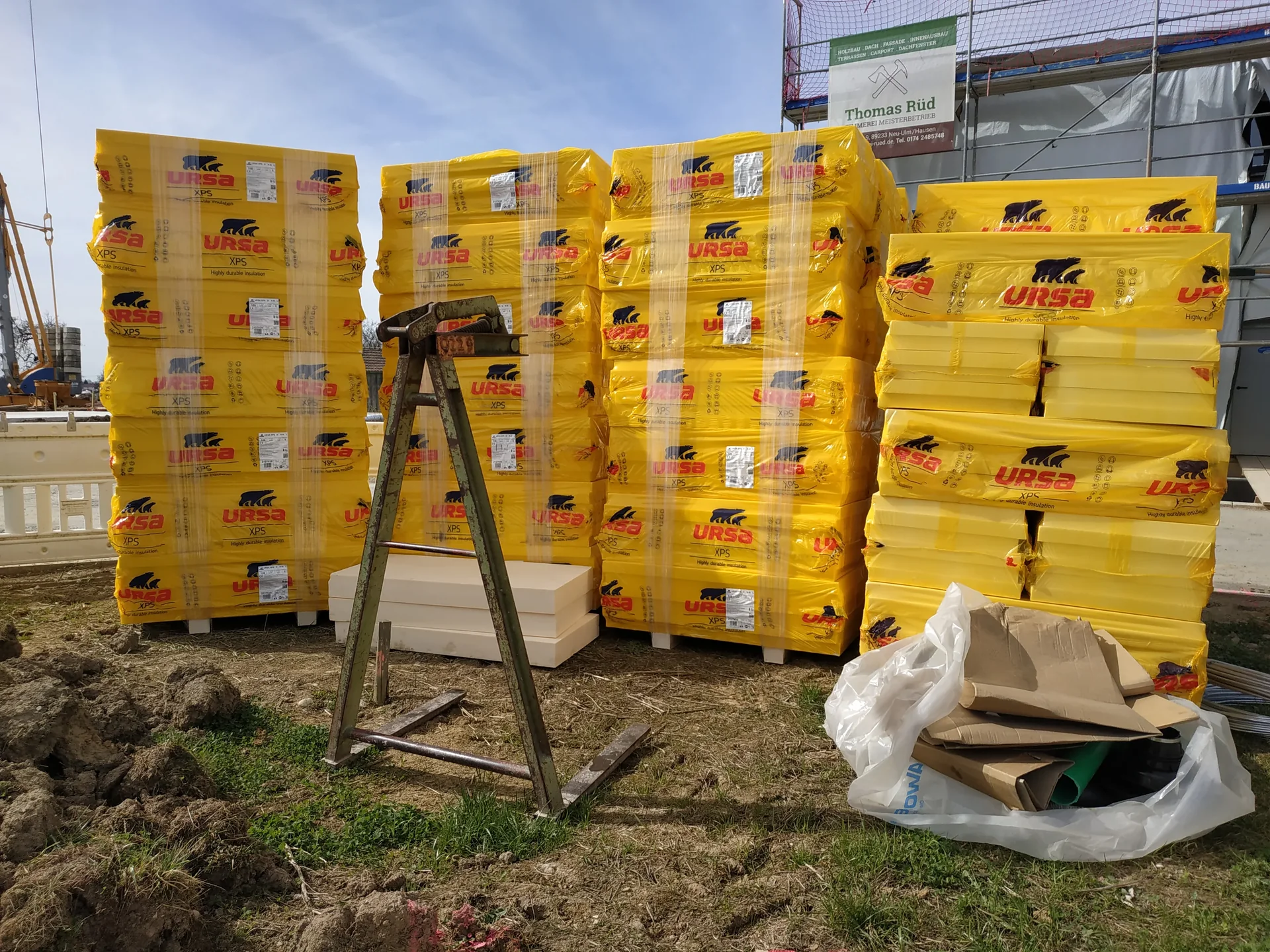 Insulation boards for a ground-bearing slab stored on a small building site