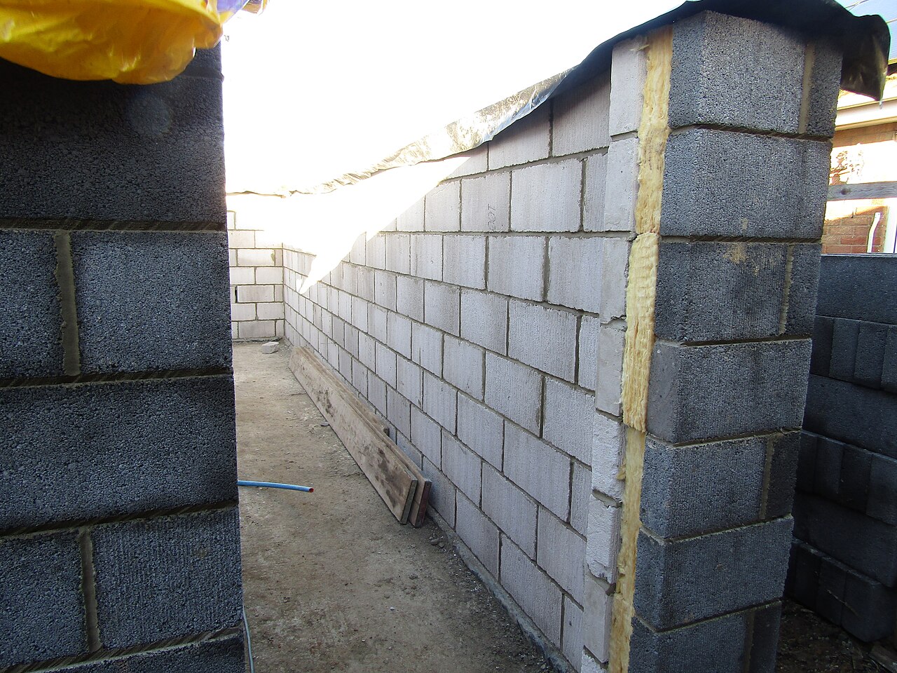 A cavity wall under construction with insulation against blockwork, Trimingham, Norfolk