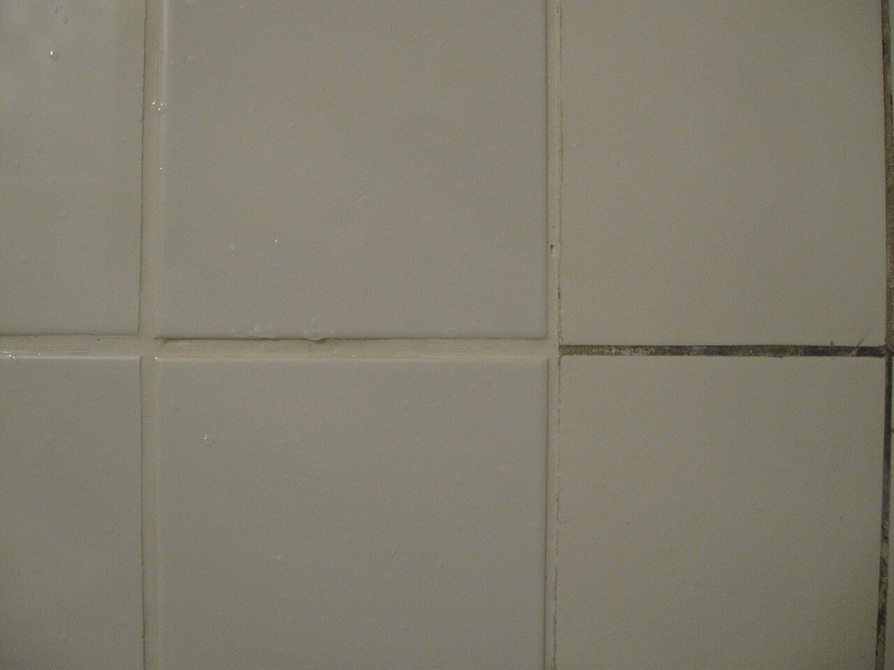 Close view of tiling with grey and white grout joints