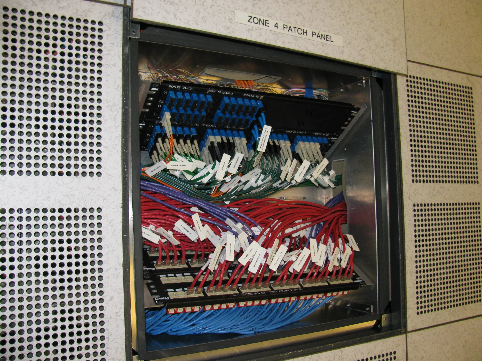 Side view of an in-floor cabling patch panel