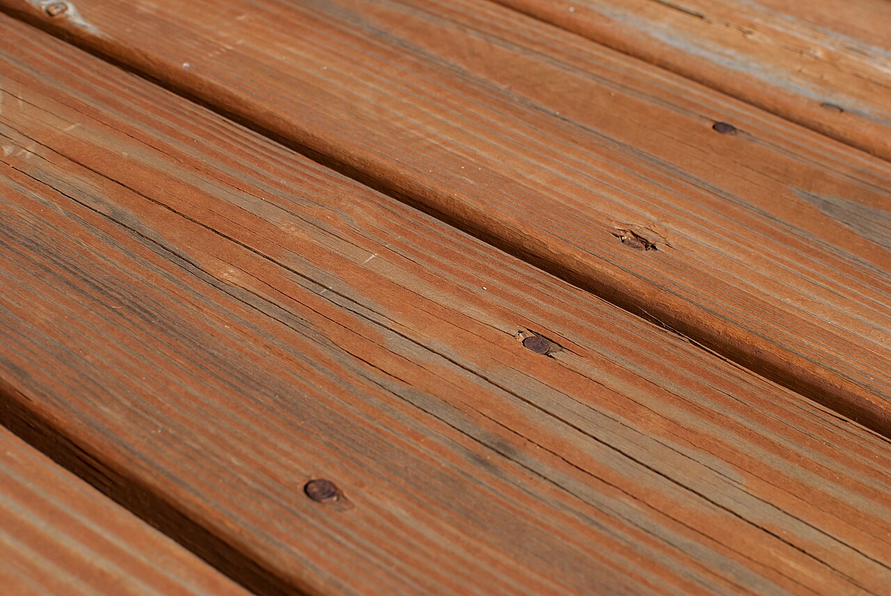 Angled view of a stained timber deck surface