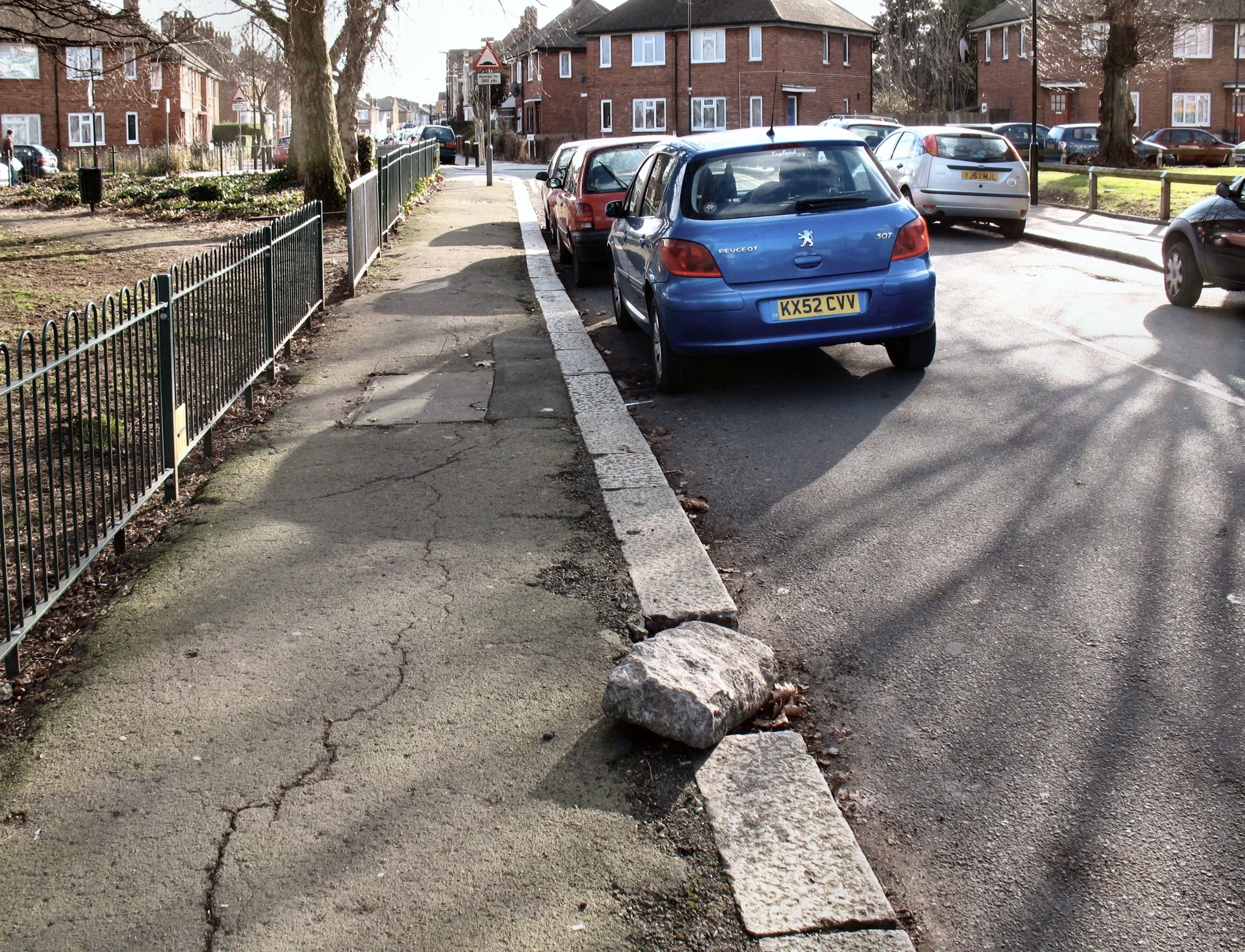 A dislodged kerbstone at the edge of a footway in Tottenham, London