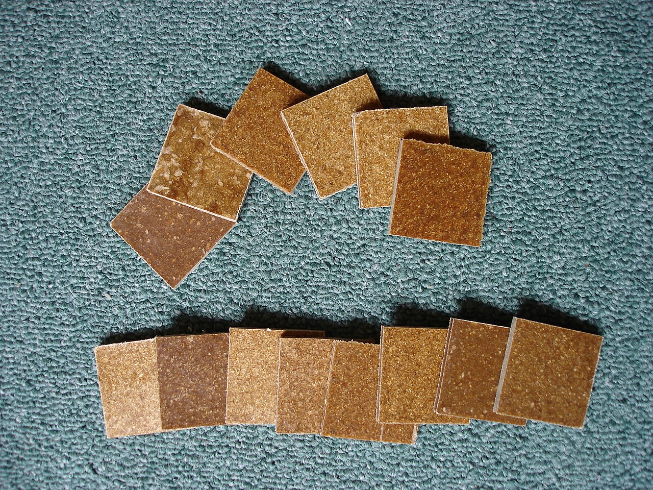 Sample boards of wood-plastic composite made to different formulations