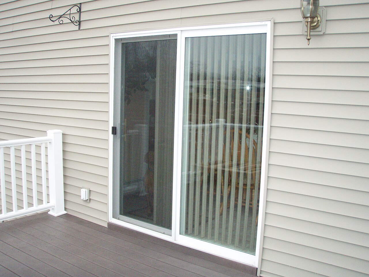 PVC-U sliding patio doors set in the rear wall of a house