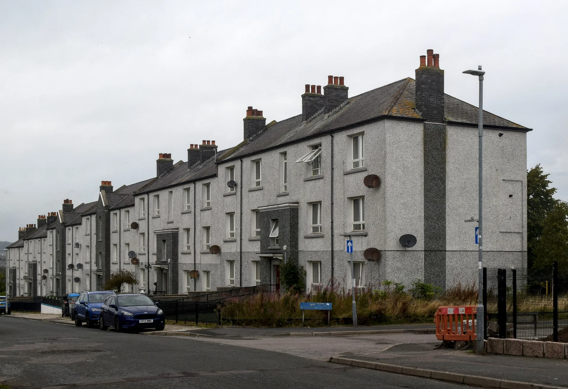 A rendered terrace of houses on Grampian Place, Torry, Aberdeen