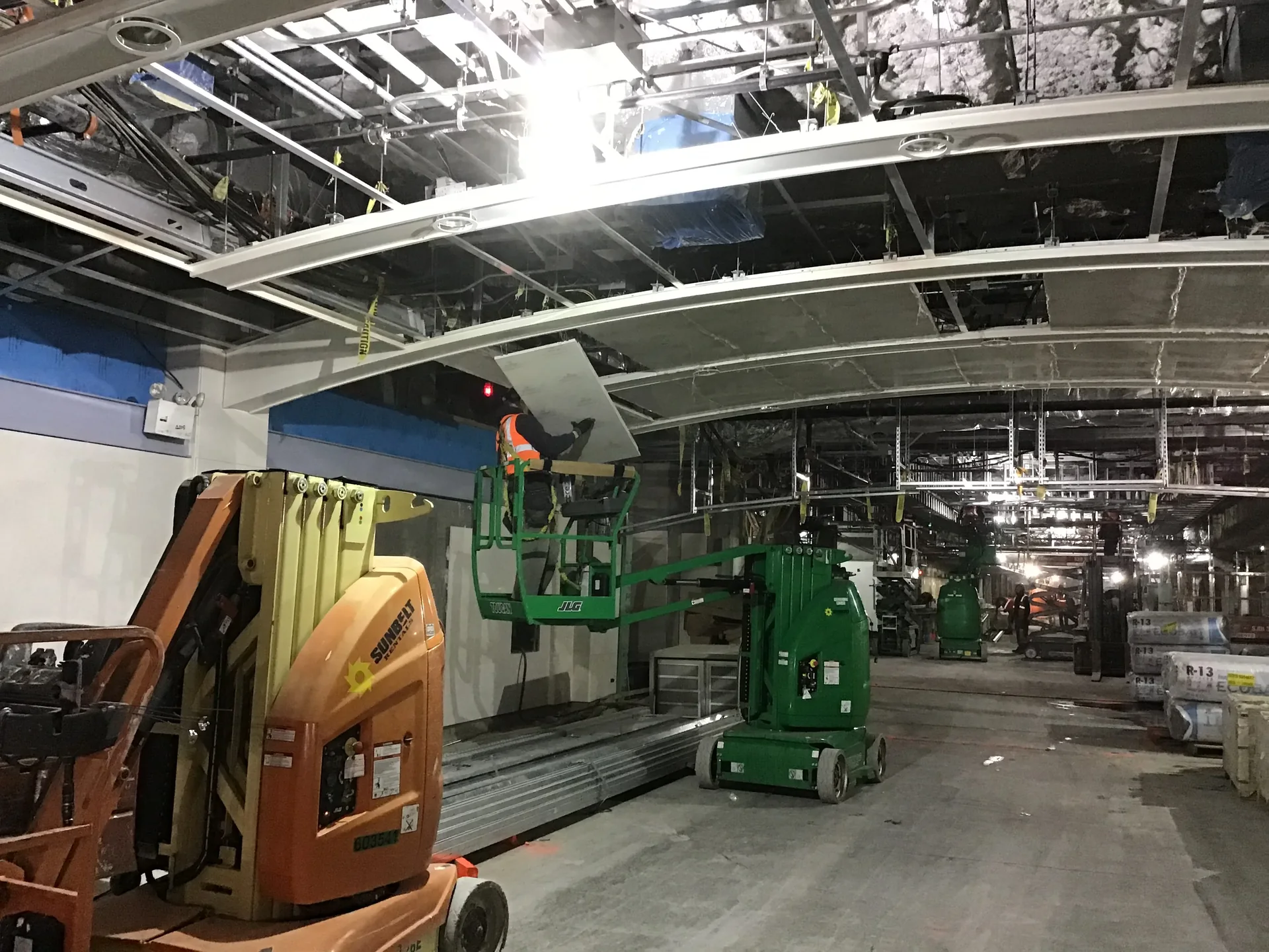 Ceiling framing being installed along a corridor