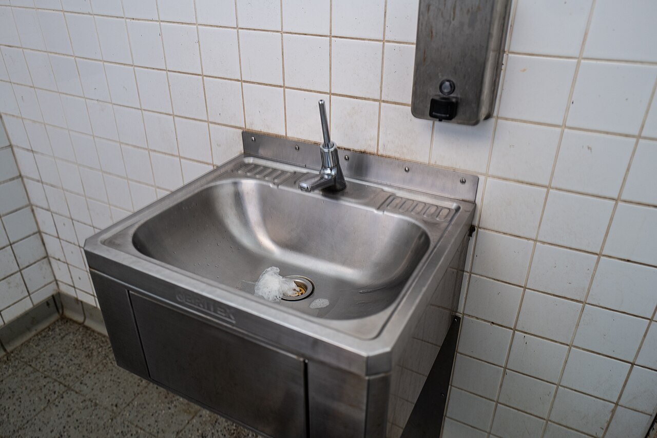 A lever handle tap in an accessible toilet