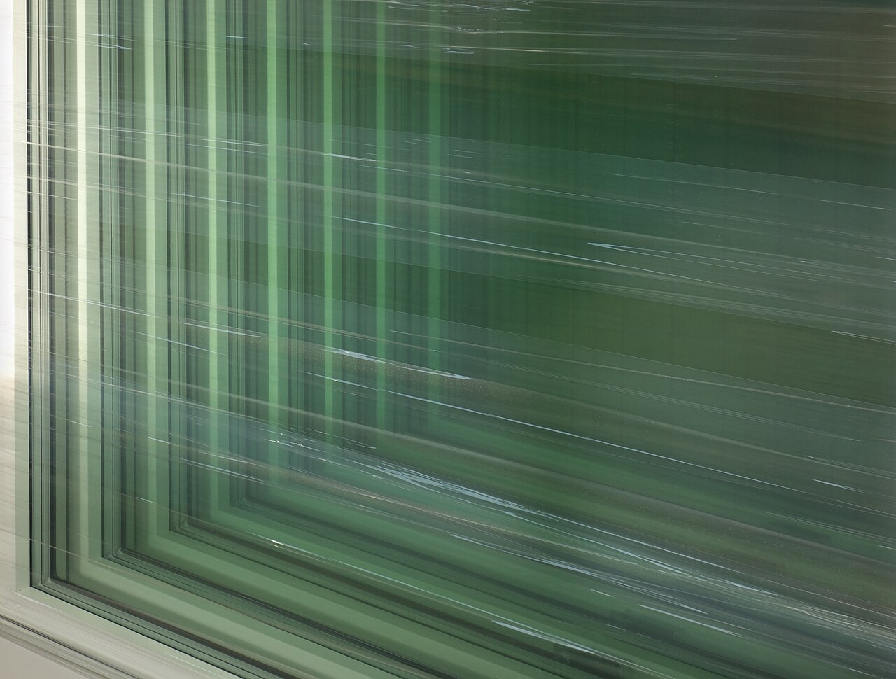 New windows stretch-wrapped in plastic and stored in a warehouse before delivery