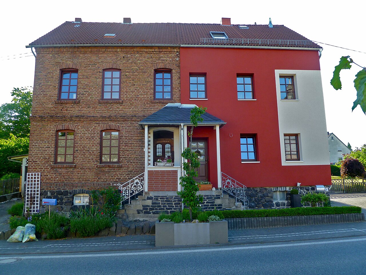 External wall insulation system partly installed on an older building in Germany