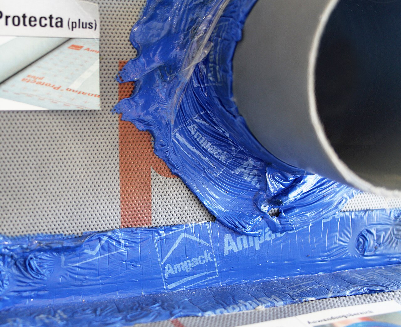 A vapour-permeable membrane with a strip of sealing tape applied along it