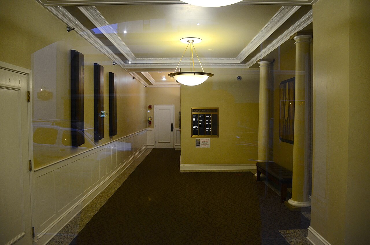 A building lobby seen through glass entrance doors