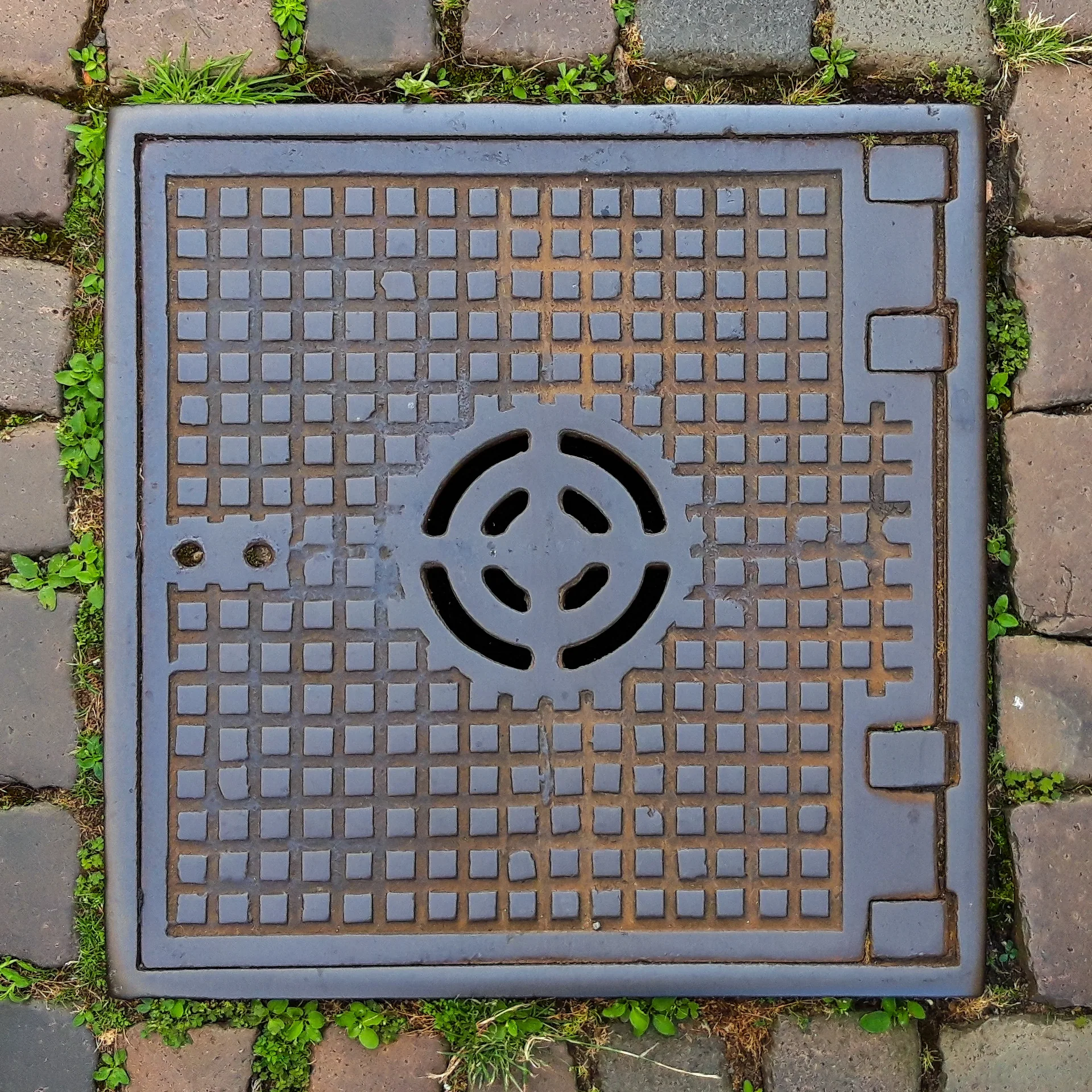 A square access cover on a drainage chamber