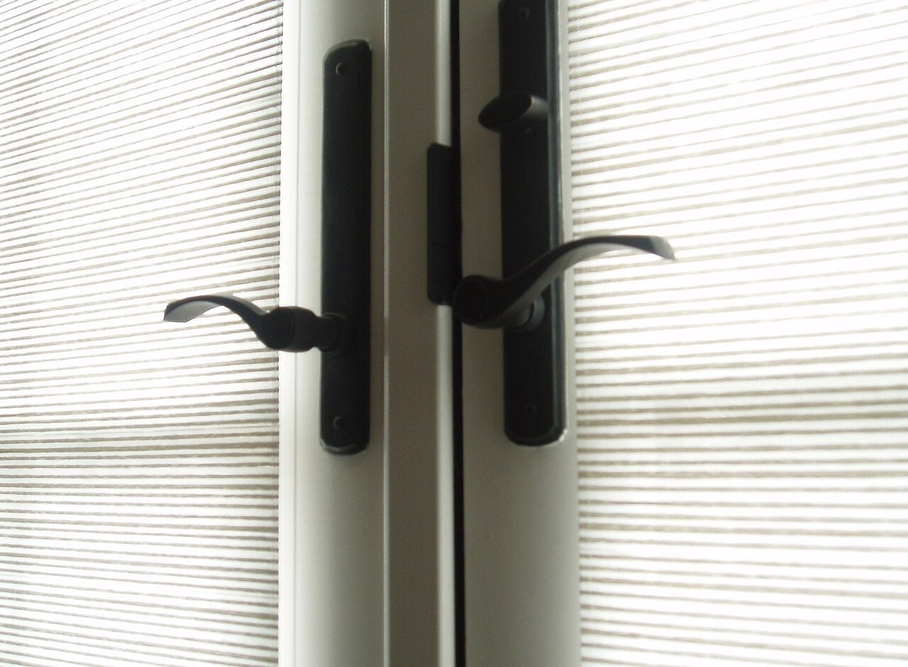 A lever-style door handle fitted to a door
