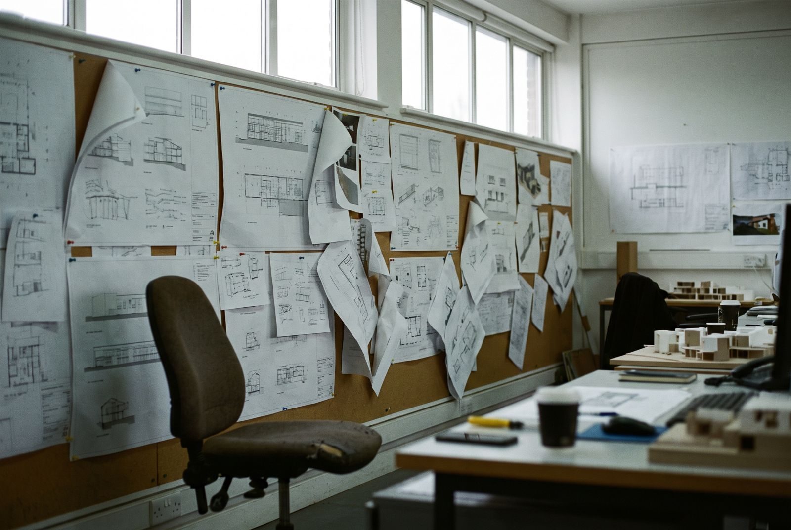 Pin-up wall of technical detail drawings in an architecture studio